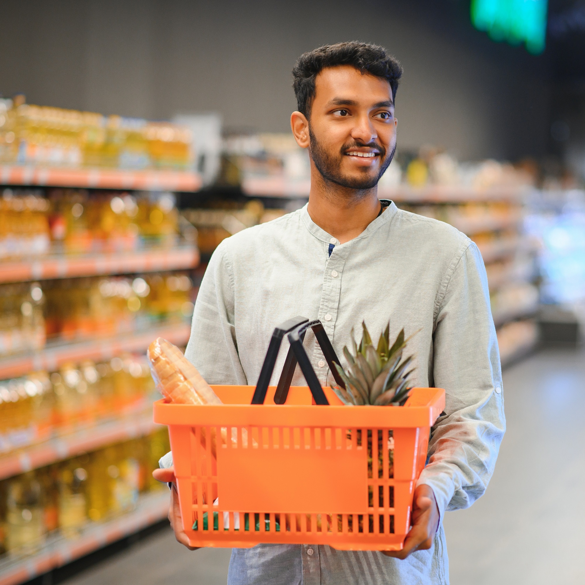 An Asian corner shop owner is excited to expand his business