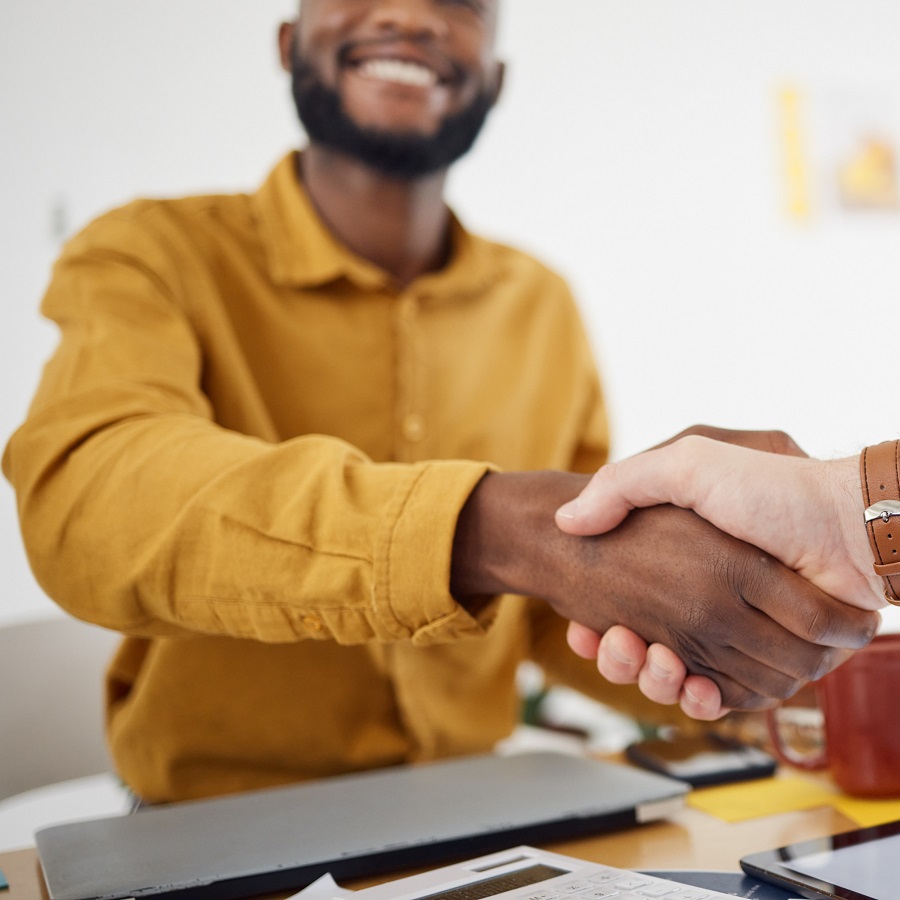 Entrepreneur shakes hands after a successful deal