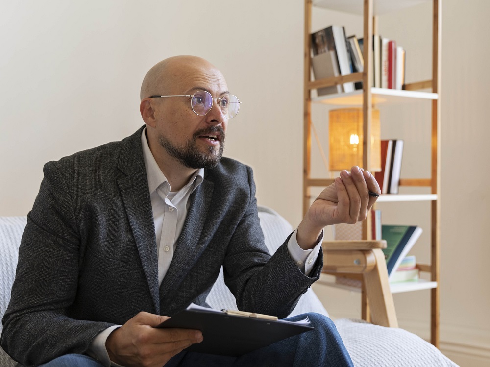 A male CFO in a meeting