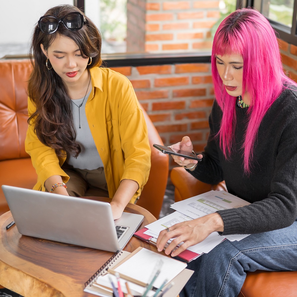 Two women work on a funding application