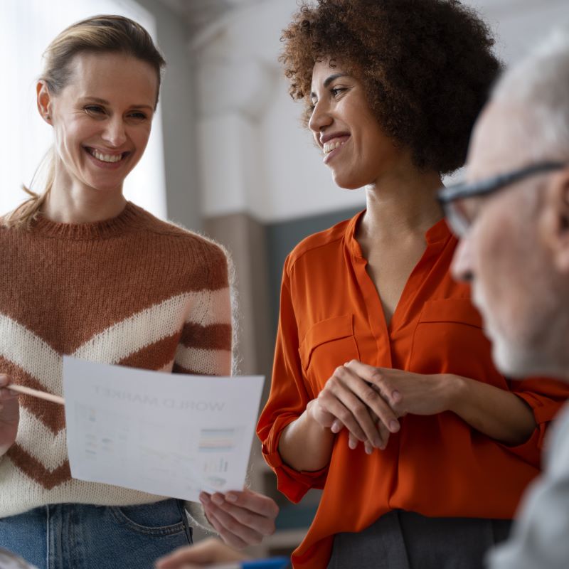 Three colleague collaborate on ongoing funding referrals