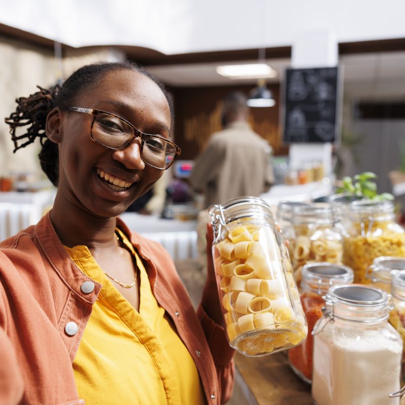 A Black female business owner shows off her store