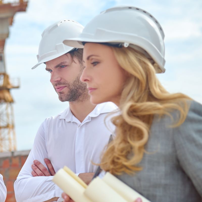 Construction engineers review project plan