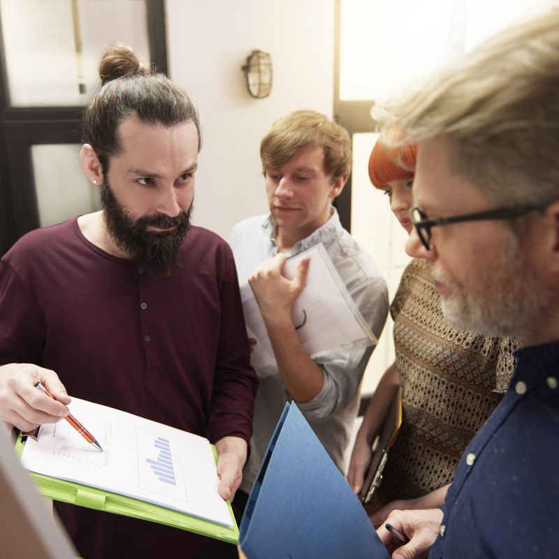 A team of marketing leaders review their business strategy